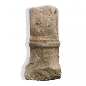 Ancient medieval stone column fragment.